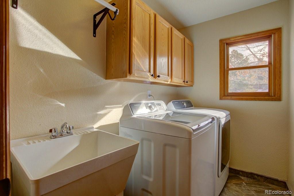 2364 Stratford Court Highlands Ranch, CO 80126 - Photo 17 of 35 a utility room with a sink washer and dryer