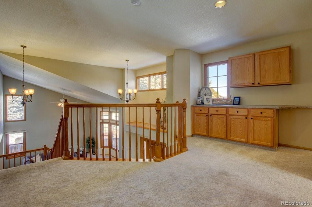 2364 Stratford Court Highlands Ranch, CO 80126 - Photo 19 of 35 a view of a kitchen with furniture and window