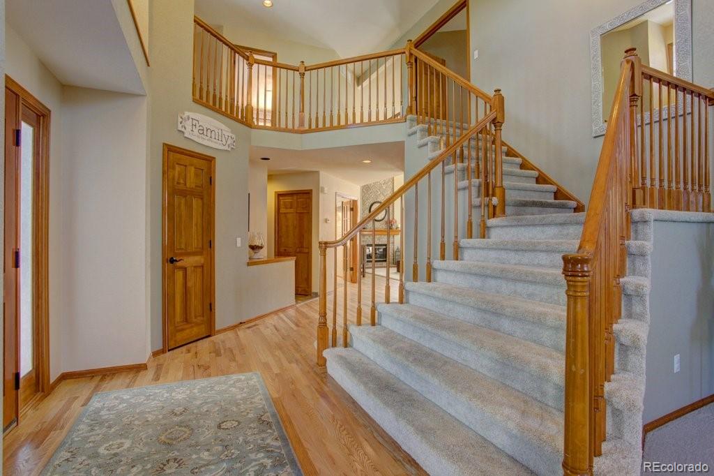 2364 Stratford Court Highlands Ranch, CO 80126 - Photo 2 of 35 a view of entryway and hall with wooden floor