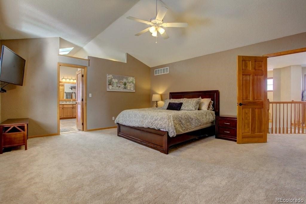 2364 Stratford Court Highlands Ranch, CO 80126 - Photo 21 of 35 a bedroom with a bed and a tv