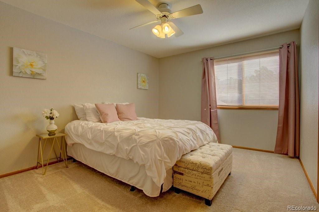 2364 Stratford Court Highlands Ranch, CO 80126 - Photo 26 of 35 a bedroom with a bed and a window