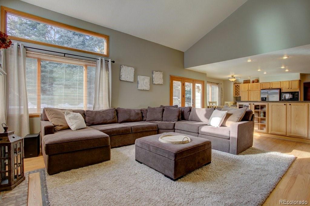 2364 Stratford Court Highlands Ranch, CO 80126 - Photo 7 of 35 a living room with furniture and a large window