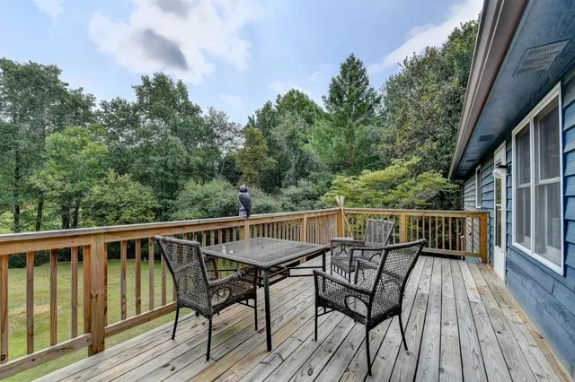 a view of a chairs and table on the wooden floor