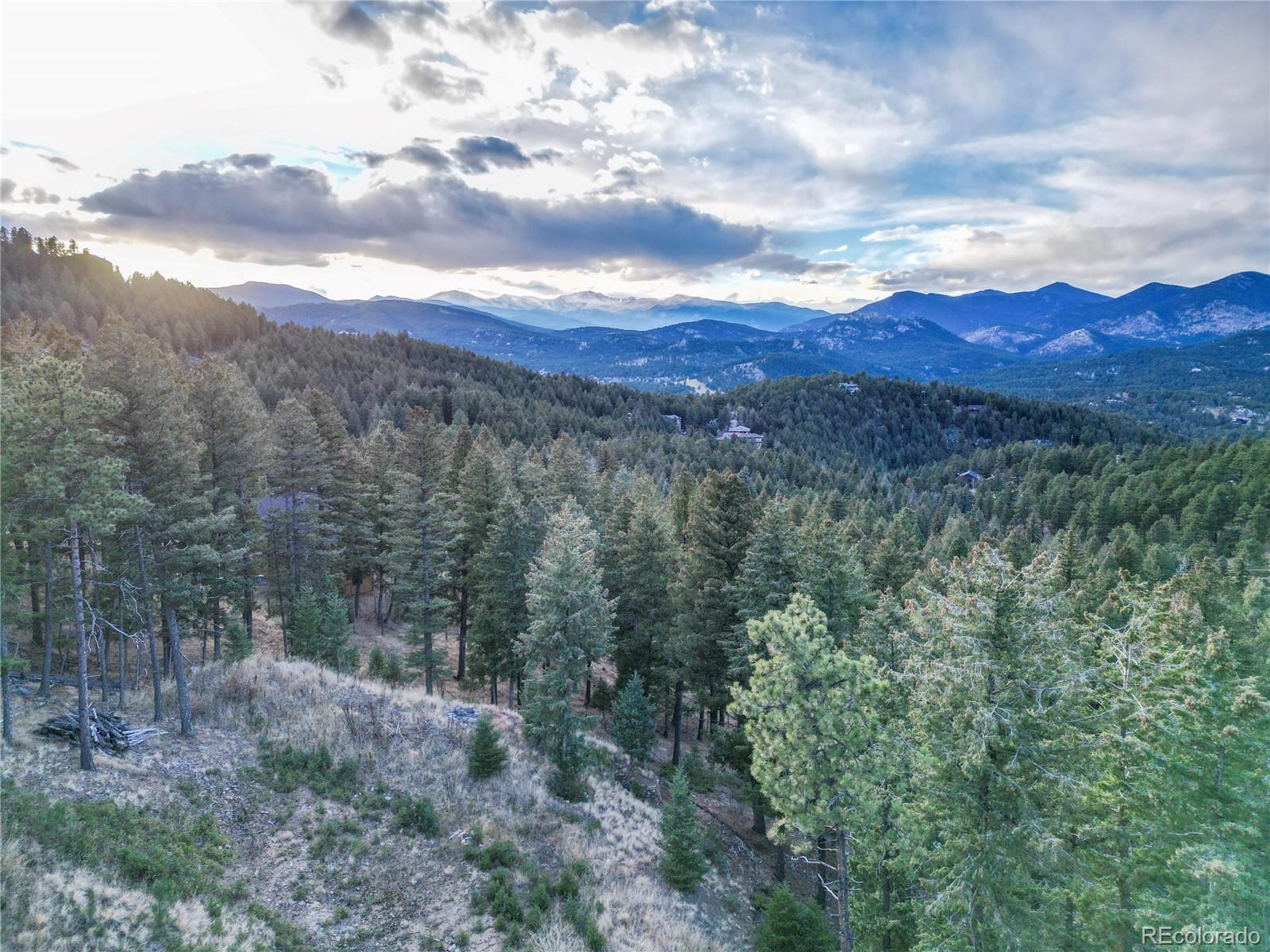 26779 Fern Gulch Road Evergreen, CO 80439 - Photo 1 of 24 a view of a city with lots of trees