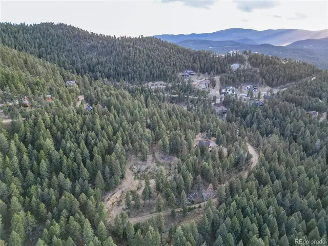 a view of mountains and valleys