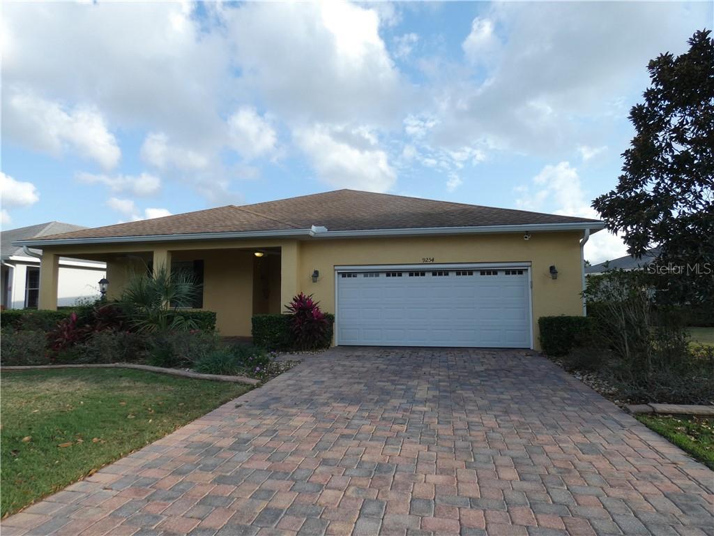 9254 Southwest 94th Loop Ocala, FL 34481 - Photo 1 of 1 Beautiful On Top of the World home with separate guest cottage inside of courtyard.