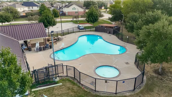 a view of a park with slide and bench