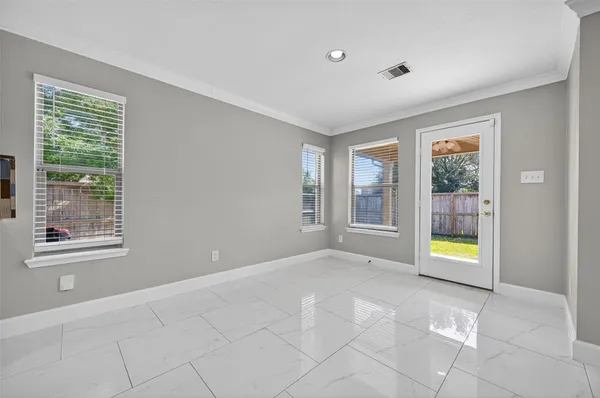 a kitchen with stainless steel appliances granite countertop a sink a stove and a refrigerator