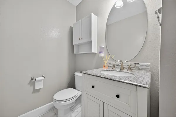 a kitchen with stainless steel appliances granite countertop a sink a oven and a large window