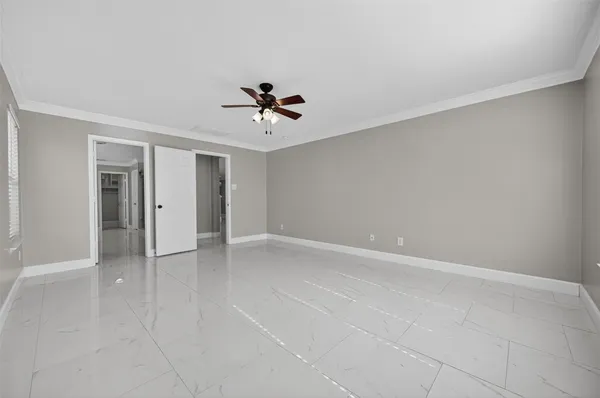 a bathroom with a granite countertop toilet sink and mirror
