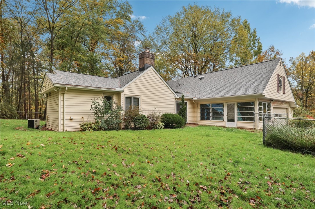 33300 South Woodland Road Cleveland, OH 44124 - Photo 50 of 50 Rear view of property featuring a chimney and roof with shingles