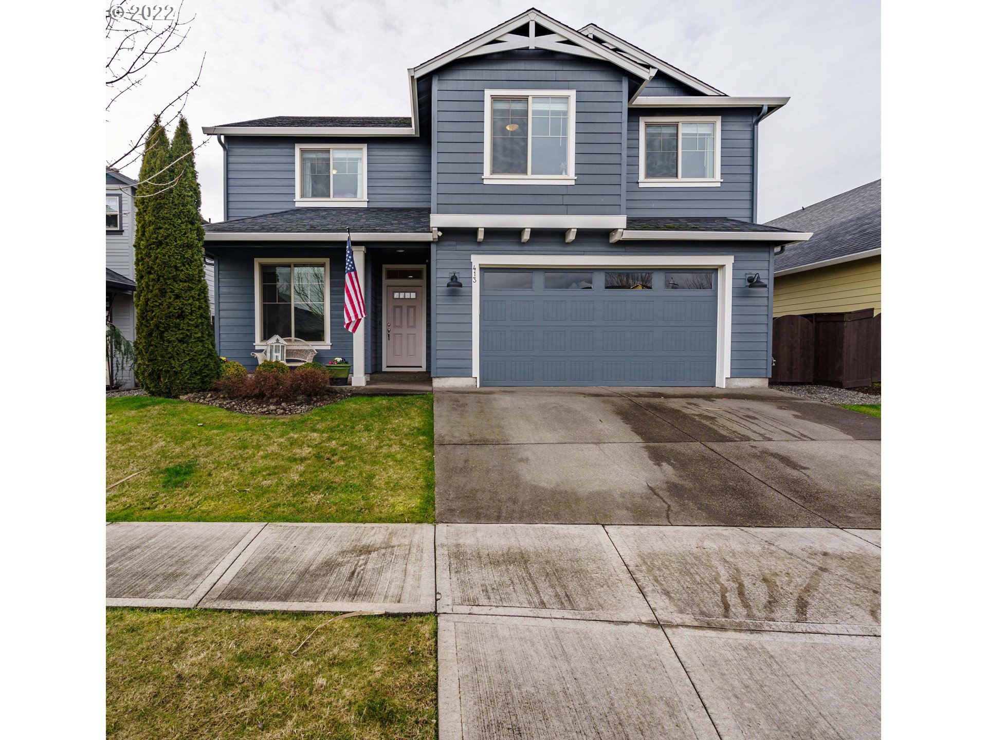413 North Helens View Drive Ridgefield, WA 98642 - Photo 1 of 32 a front view of a house with garden