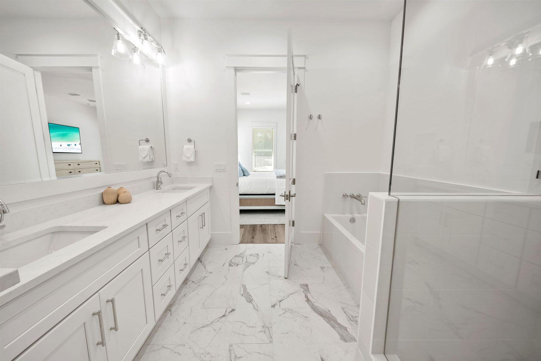 23 Sweet Gum Loop Inlet Beach Inlet Beach, FL 32461 - Photo 15 of 35 a bathroom with a double vanity sink mirror double and shower