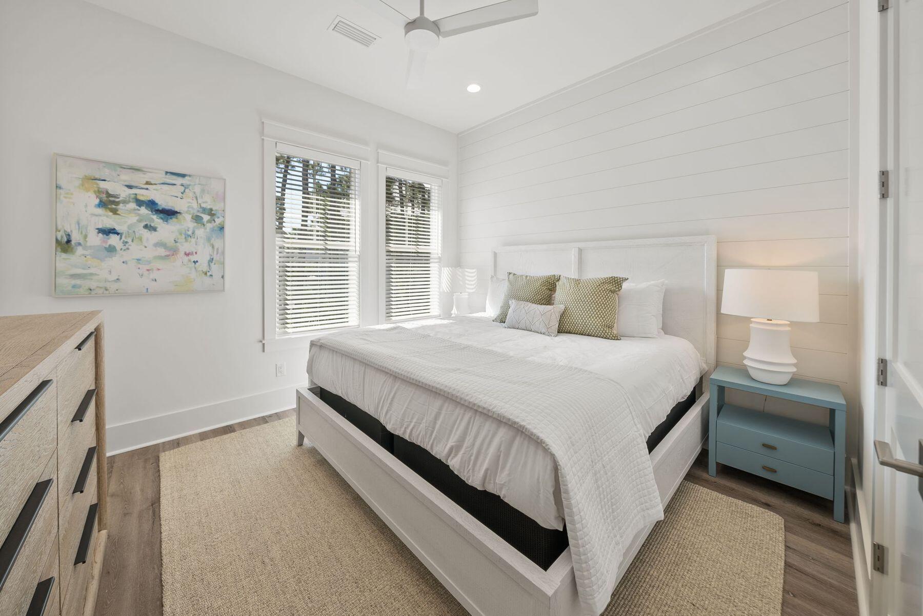 23 Sweet Gum Loop Inlet Beach Inlet Beach, FL 32461 - Photo 26 of 35 a bedroom with a large bed and a window