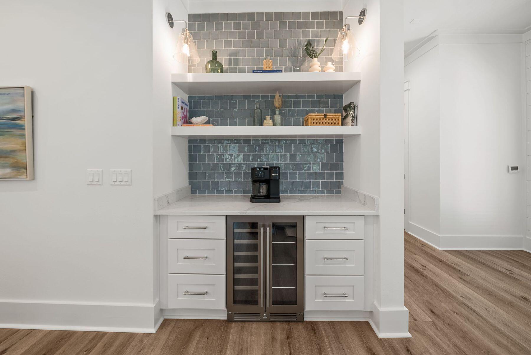 23 Sweet Gum Loop Inlet Beach Inlet Beach, FL 32461 - Photo 10 of 35 a kitchen with a stove and wooden floor