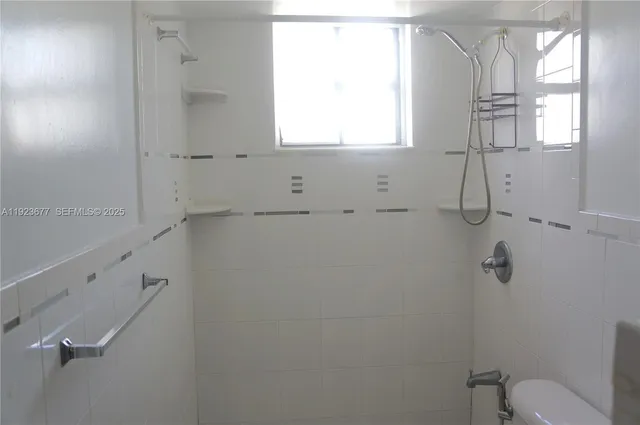 a view of gallery with wooden floor