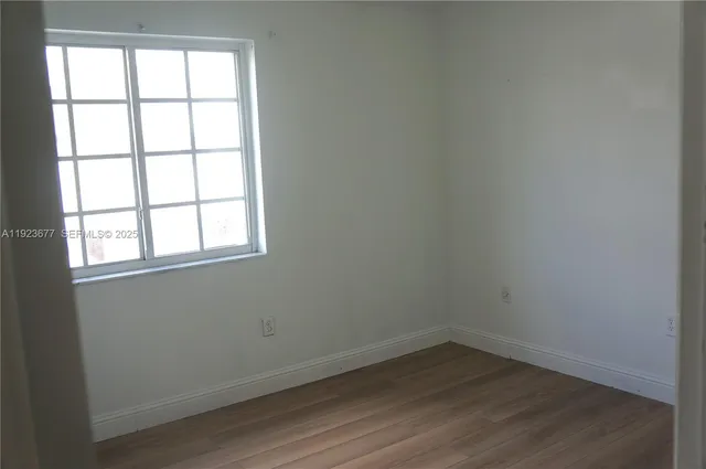 a white toilet sitting next to a bath tub