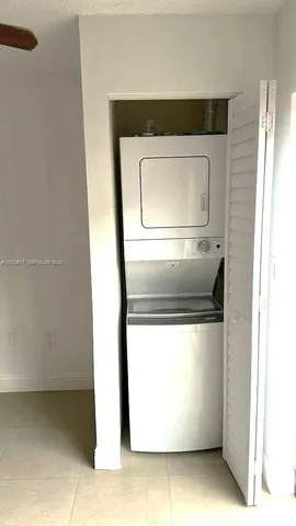 a utility room with washer and dryer