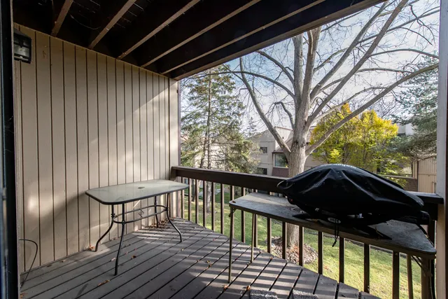 a view of a balcony with furniture