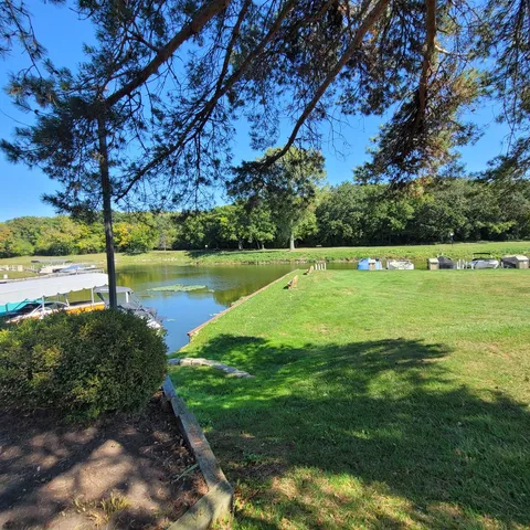 a view of a golf course with an ocean