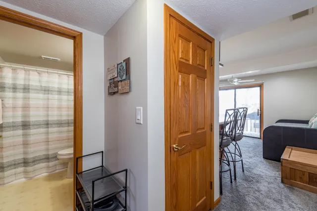 a view of elevator with hallway and furniture