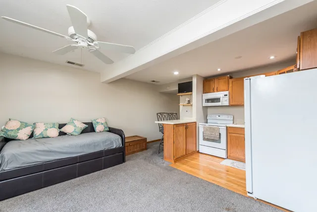 a bedroom with furniture and a chandelier