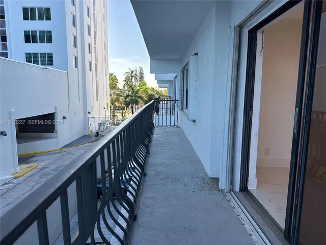 a view of balcony with wooden floor and stairs