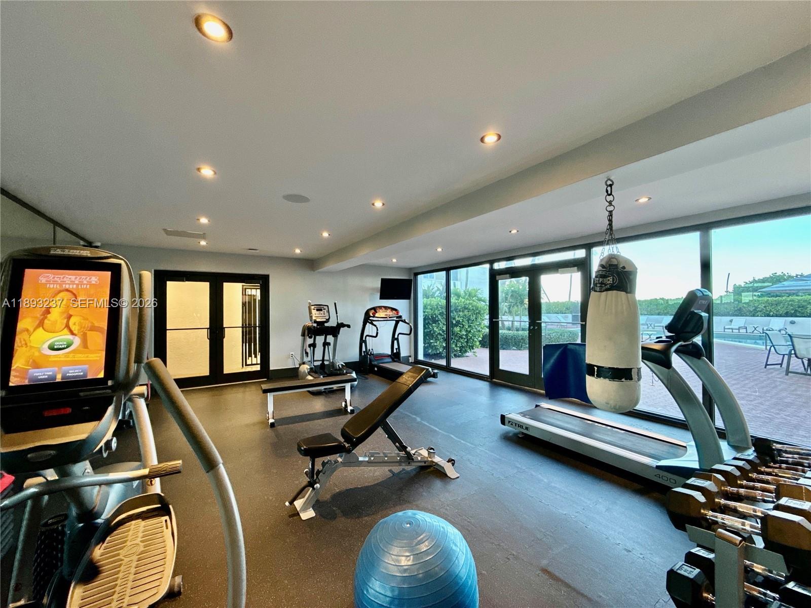 5415 Collins Avenue, Unit 304 Miami Beach, FL 33140 - Photo 18 of 20 a view of a room with gym equipment