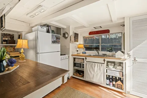 a kitchen with a sink appliances and cabinets