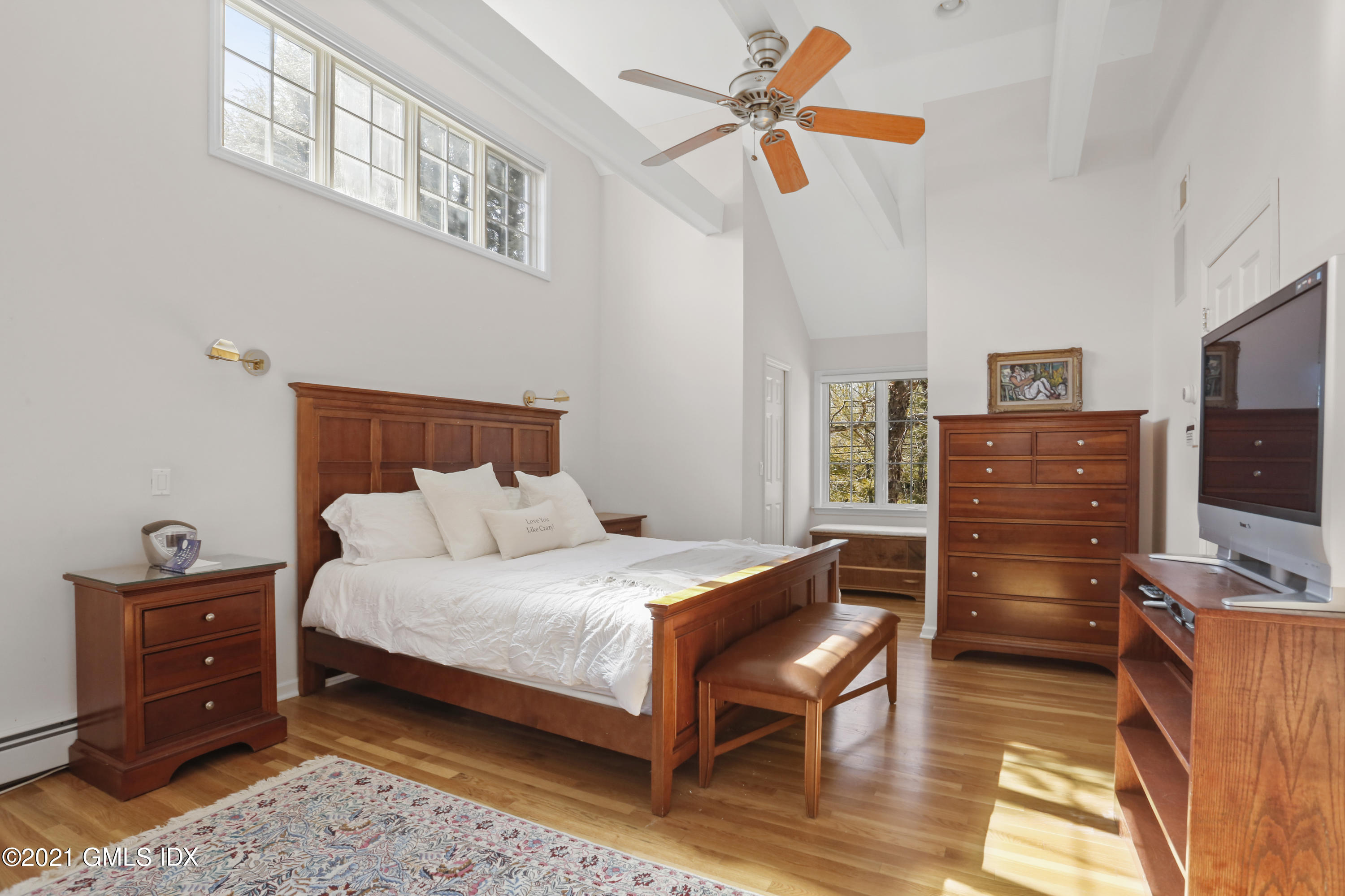 3 Old Wagon Road Old Greenwich, CT 06870 - Photo 13 of 37 a bedroom with a bed and furniture