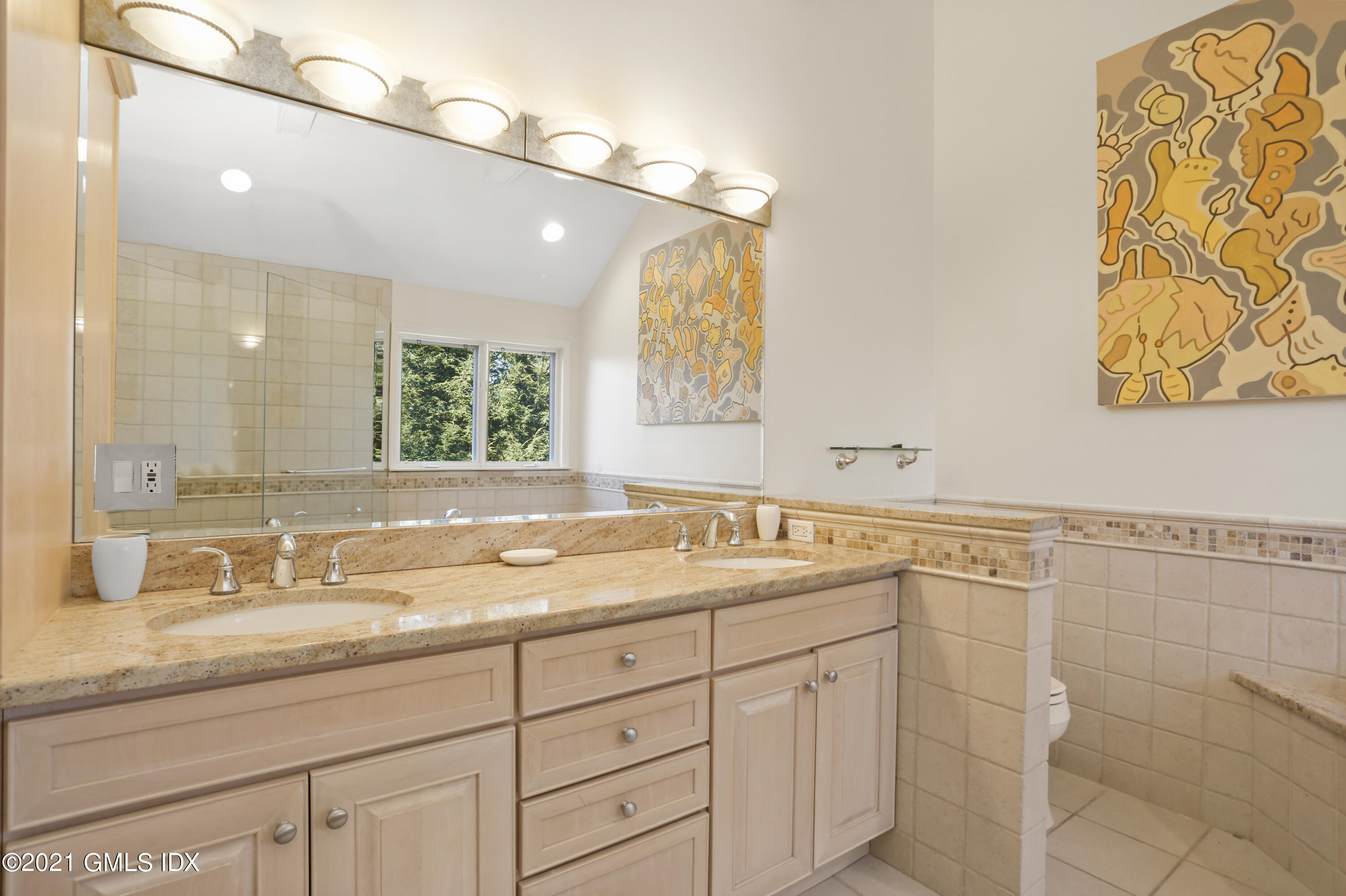 3 Old Wagon Road Old Greenwich, CT 06870 - Photo 15 of 37 a bathroom with a granite countertop sink mirror and double