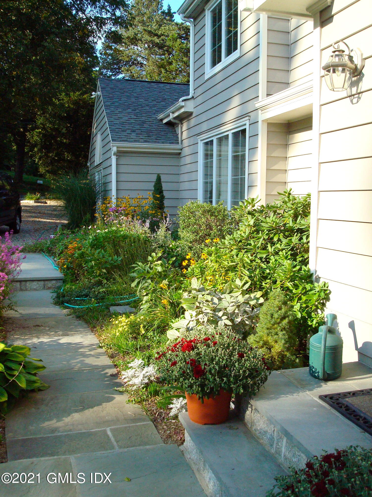 3 Old Wagon Road Old Greenwich, CT 06870 - Photo 18 of 37 a view of a house with a yard and garden
