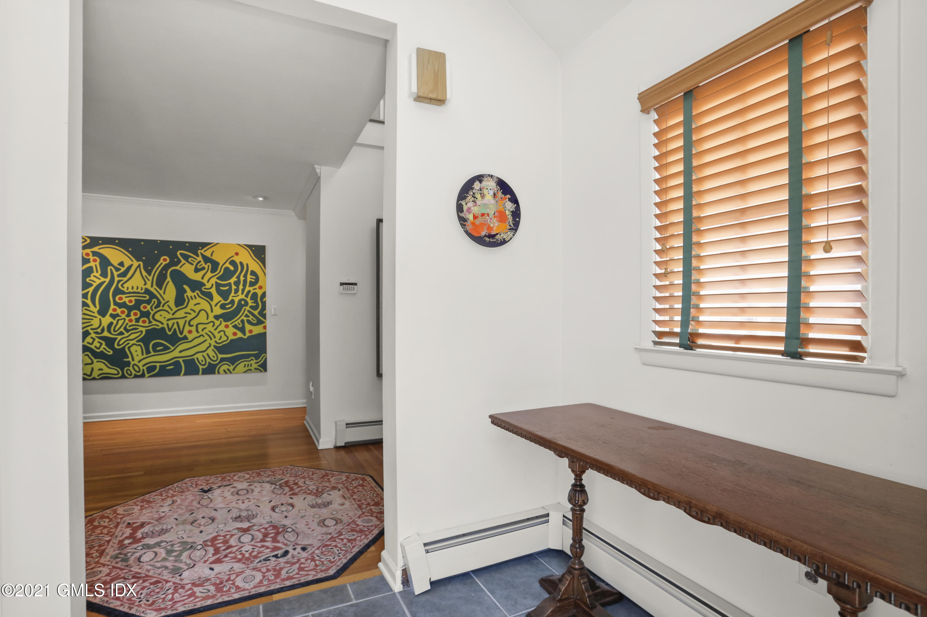 3 Old Wagon Road Old Greenwich, CT 06870 - Photo 3 of 37 a view of a workspace with wooden floor and a window