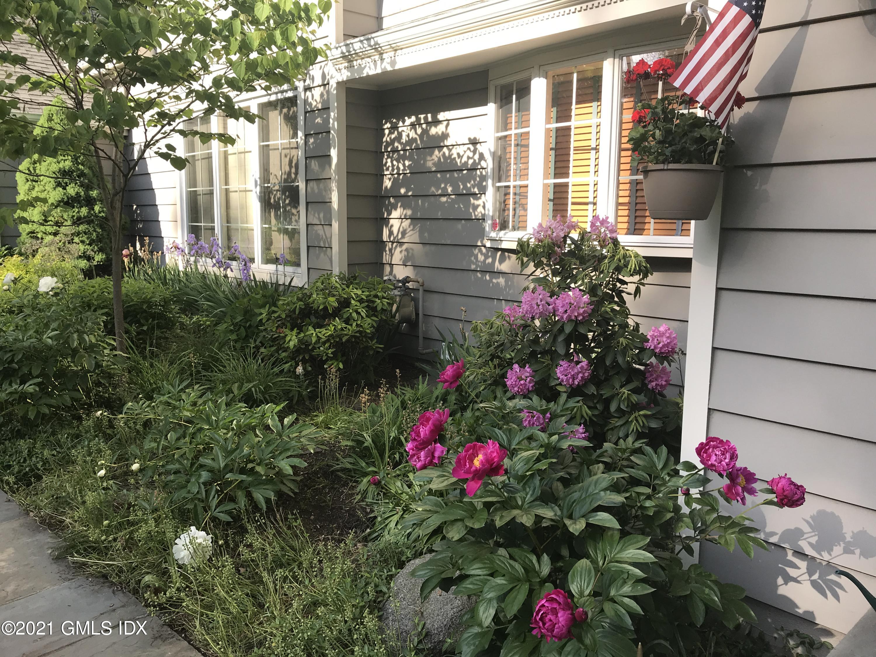 3 Old Wagon Road Old Greenwich, CT 06870 - Photo 34 of 37 a view of a house that has a flower garden