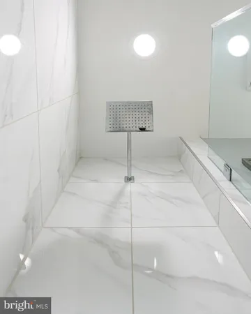 a bathroom with a sink mirror vanity and toilet