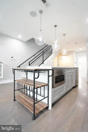 a bathroom with a shower a toilet and a sink