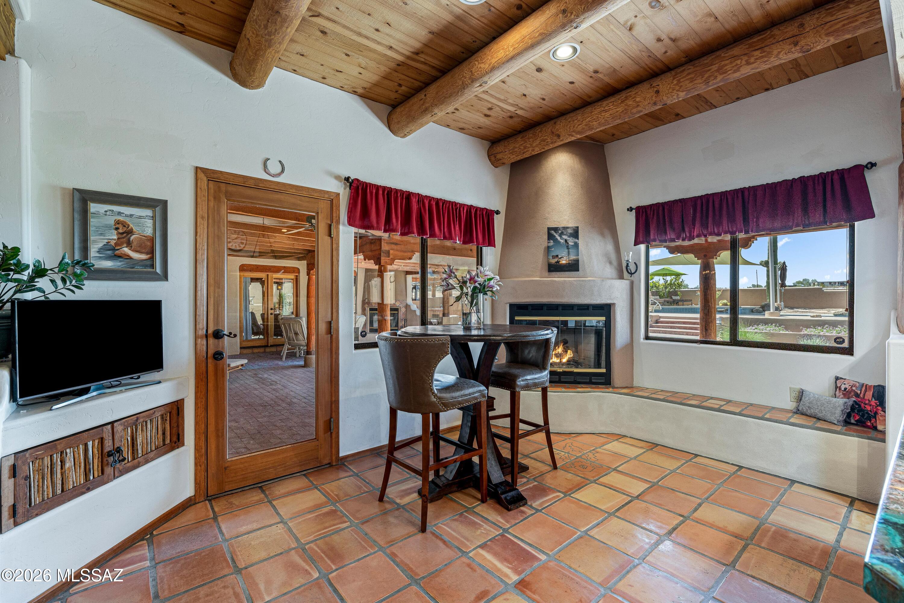 11160 East Golf Links Road Tucson, AZ 85730 - Photo 16 of 51 There is both a breakfast nook and breakfast bar to eat at next to your beehive fireplace overlooking the backyard.