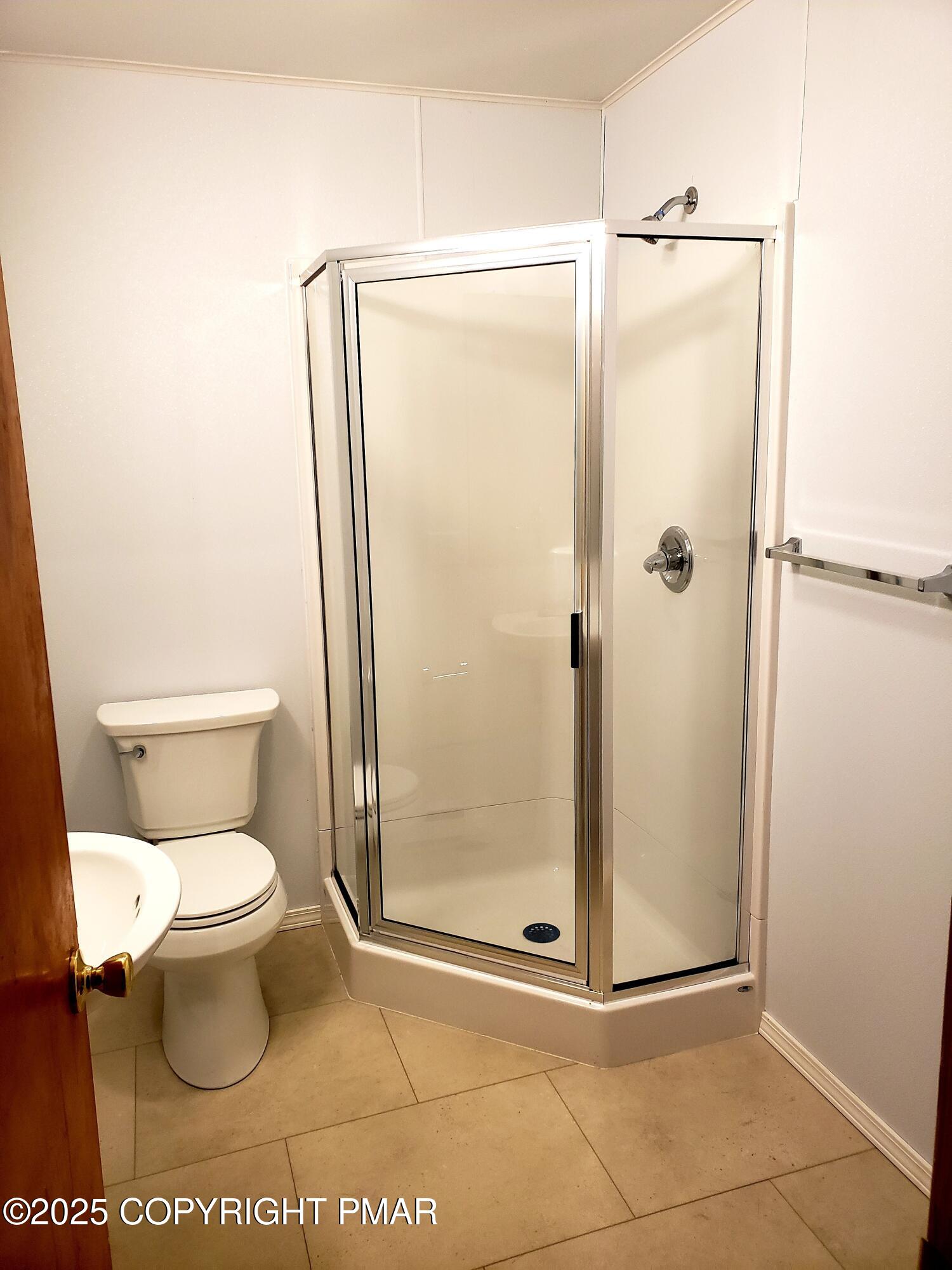 1200 Cherry Lane Road, Unit 102 East Stroudsburg, PA 18301 - Photo 7 of 10 a bathroom with a toilet and a shower