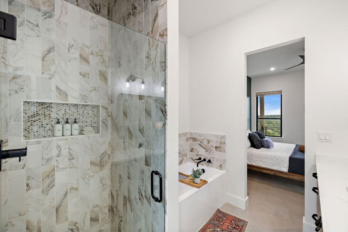 11 Sacramento Boerne, TX 78006 - Photo 24 of 40 Full bath featuring a marble finish shower, a bath, and ensuite bath