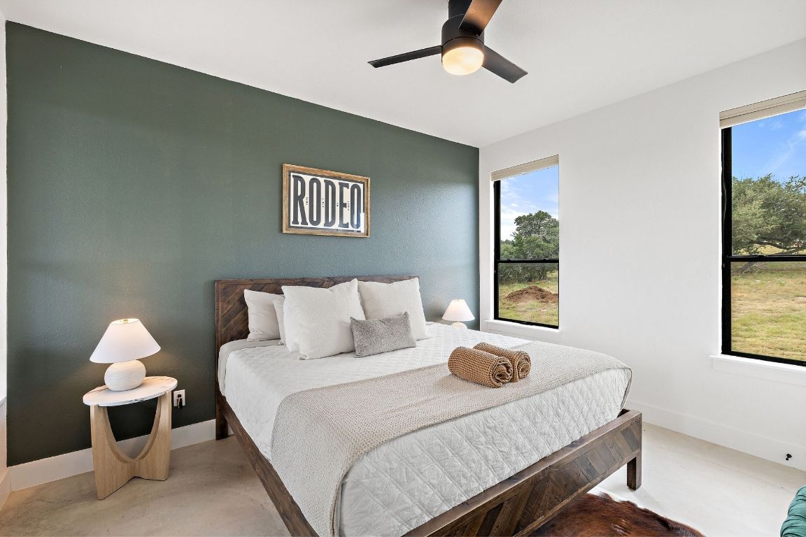11 Sacramento Boerne, TX 78006 - Photo 28 of 40 Bedroom featuring a ceiling fan and concrete floors