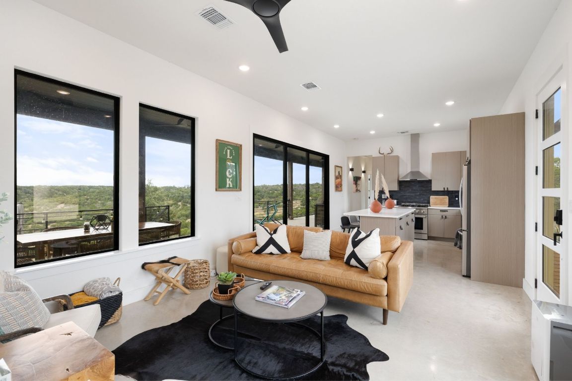 11 Sacramento Boerne, TX 78006 - Photo 6 of 40 Living area featuring concrete flooring, recessed lighting, and a ceiling fan