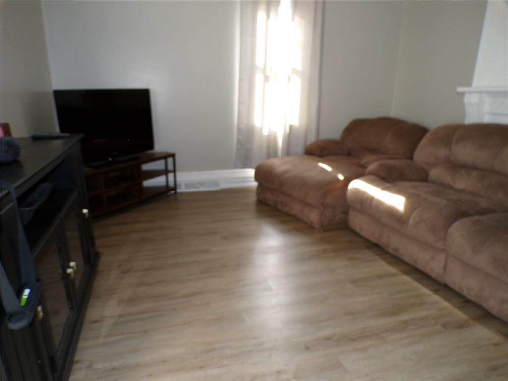 1026 Washington Avenue Monaca, PA 15061 - Photo 3 of 16 a living room with furniture and a flat screen tv