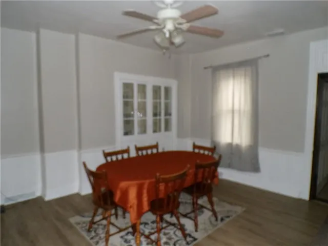 a view of a dining room with furniture and window