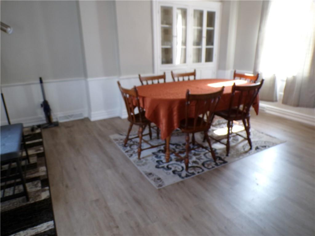 1026 Washington Avenue Monaca, PA 15061 - Photo 4 of 16 a view of a dining room with furniture and wooden floor