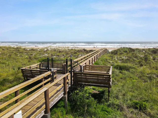 a view of a balcony with an ocean