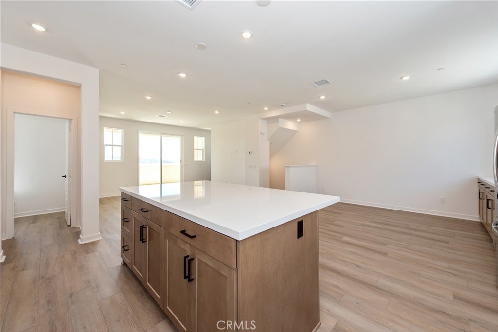 211 Ruby Road Rancho Mission Viejo, CA 92694 - Photo 17 of 41 a kitchen with a wooden floor and window