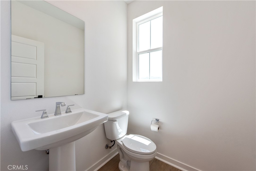 211 Ruby Road Rancho Mission Viejo, CA 92694 - Photo 18 of 41 a bathroom with a sink toilet and a mirror