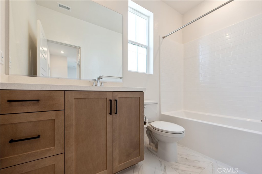211 Ruby Road Rancho Mission Viejo, CA 92694 - Photo 25 of 41 a bathroom with a granite countertop sink toilet and shower
