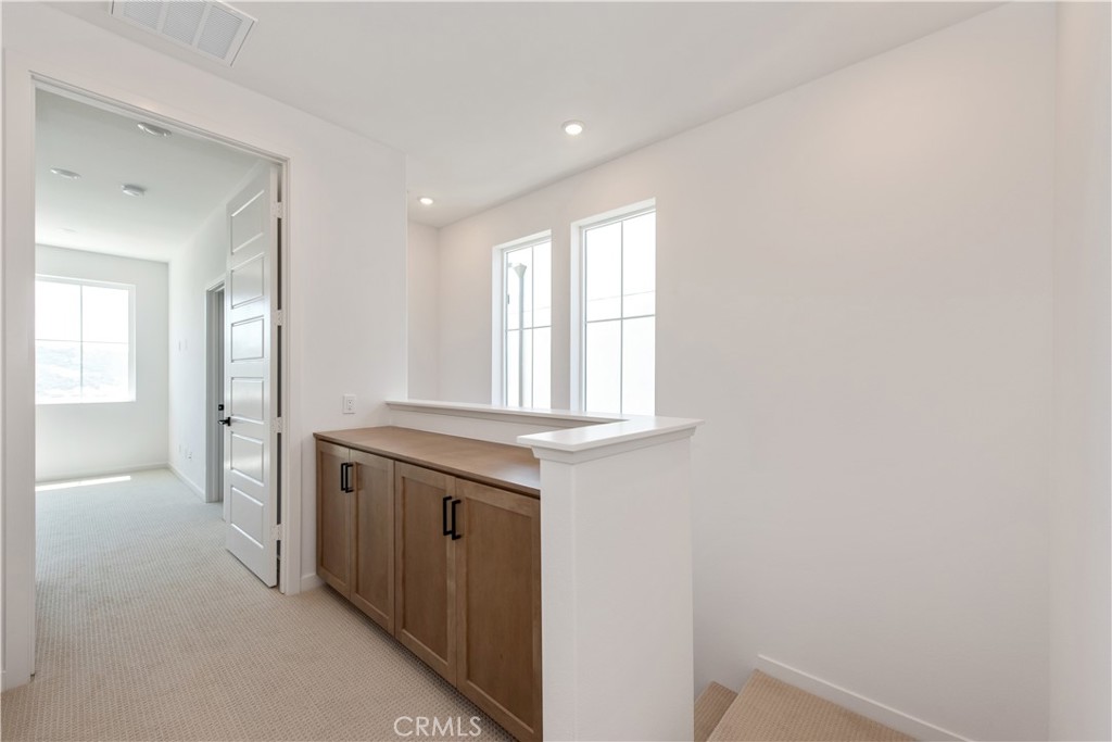 211 Ruby Road Rancho Mission Viejo, CA 92694 - Photo 27 of 41 a view of a kitchen from the hallway