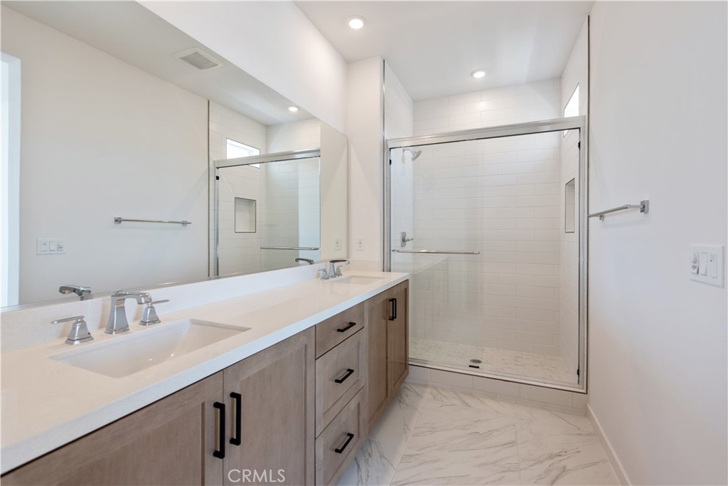 211 Ruby Road Rancho Mission Viejo, CA 92694 - Photo 31 of 41 a bathroom with a double vanity sink mirror and shower